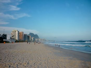 View of beach with city in background