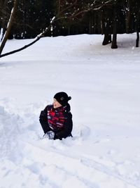 Man in snow on field during winter