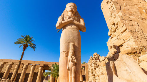 Low angle view of statue against clear sky