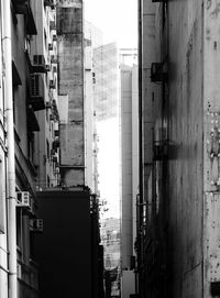 Buildings in city against clear sky