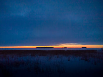 Scenic view of sea against sky at sunset