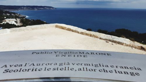 High angle view of text on beach