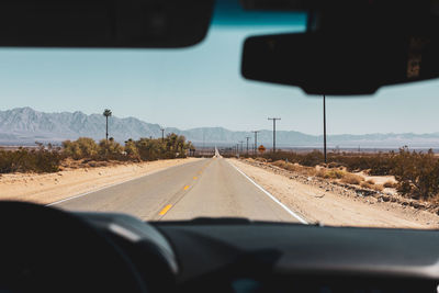 Road seen through car windshield