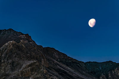 Low angle view of moon against sky at night