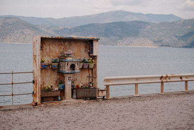 Scenic view of sea against sky with shrine in front