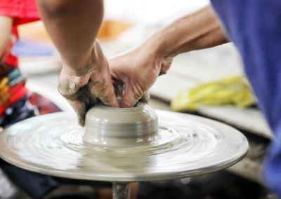 Midsection of man working at workshop