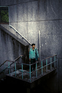 High angle view of man standing on staircase