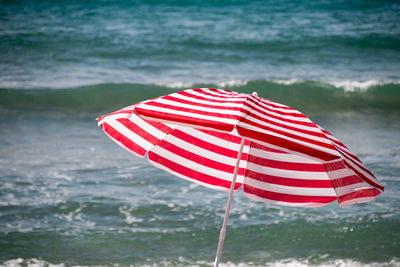 Close-up of flag against sea