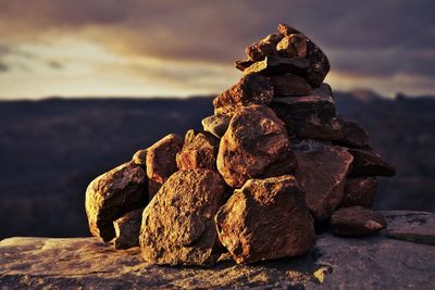 Close-up of stack of rocks on shore