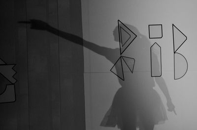 Close-up of silhouette text on hand