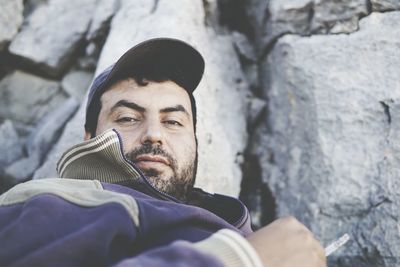 Portrait of man against rock formation