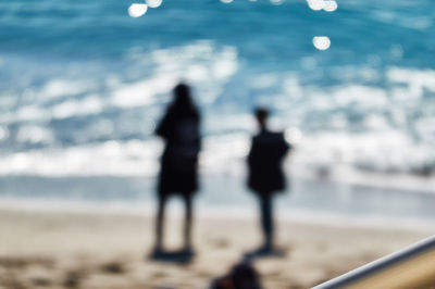 Shadow of people on beach