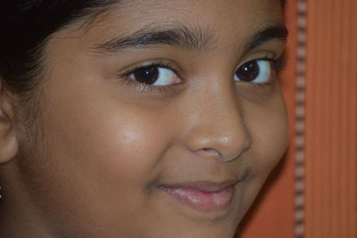 Close-up portrait of smiling girl