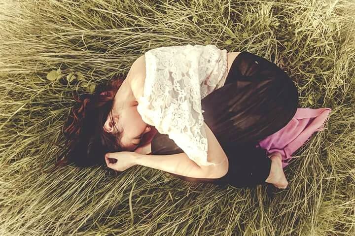 MAN SLEEPING ON GRASS