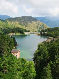 Scenic view of lake and mountains against sky