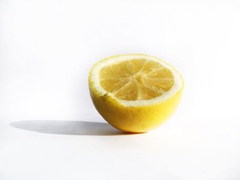 Close-up of lemon against white background