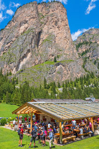 Group of people on mountain against the sky