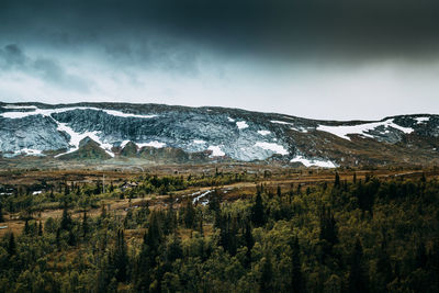 Scenic view of snowcapped mountains against sky