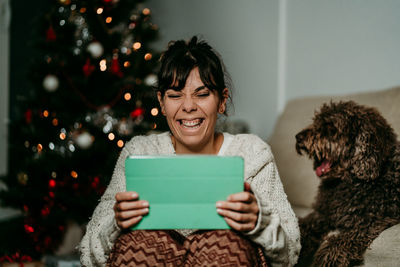 Portrait of young woman using digital tablet