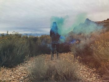 Man standing in smoke