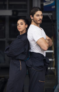 Portrait of young couple standing outdoors