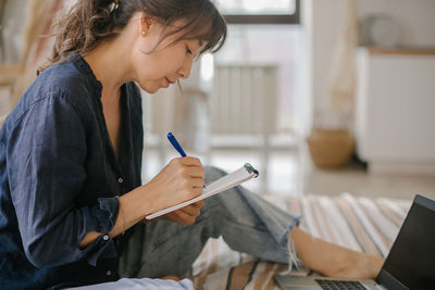 Woman preparing strategy while working at home