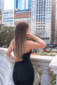 Rear view of woman standing in city