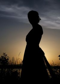 Silhouette of people at sunset