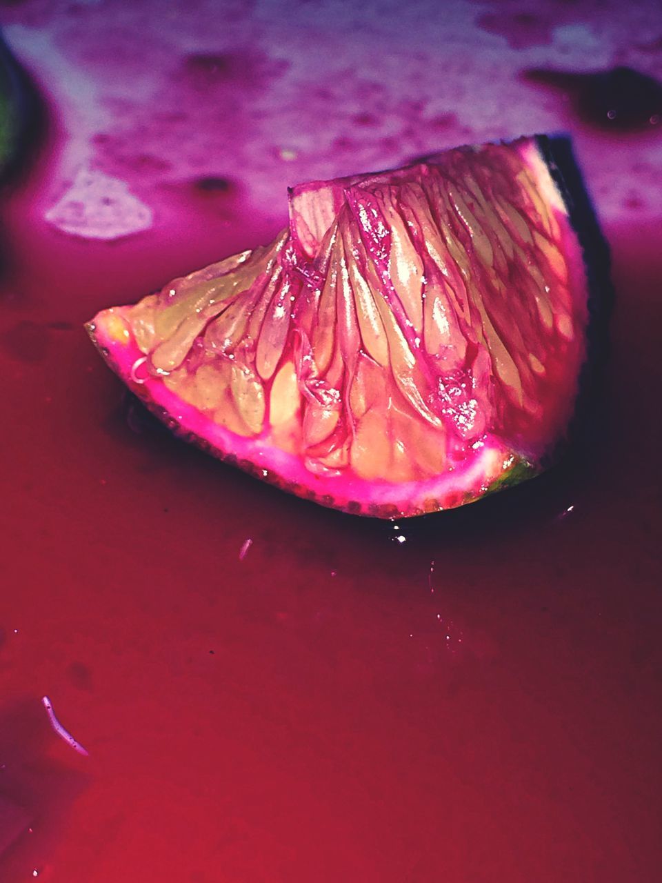 freshness, food and drink, red, close-up, water, drop, indoors, wet, high angle view, still life, food, pink color, refreshment, table, no people, healthy eating, selective focus, purity, single object, fruit