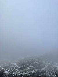 Scenic view of mountains against sky during winter