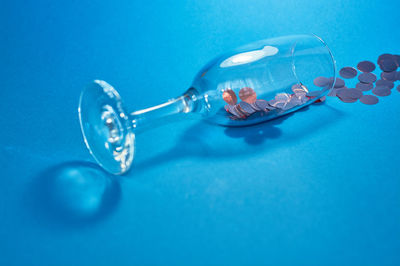 Close-up of blue drinking glass on table