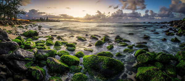 Scenic view of sea against sky at sunset