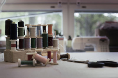 Variety of thread spools on table at home