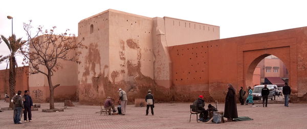 Group of people in front of historical building