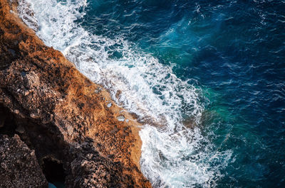 Waves splashing on rocks