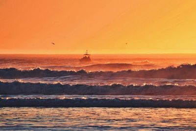 Scenic view of sea at sunset