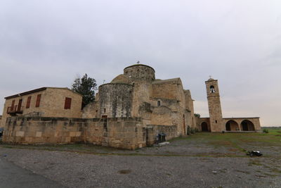 Low angle view of old church of apostolos barnavas against sky