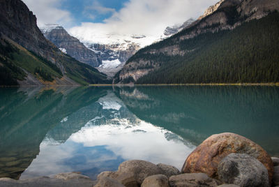 Scenic view of lake and mountains against sky