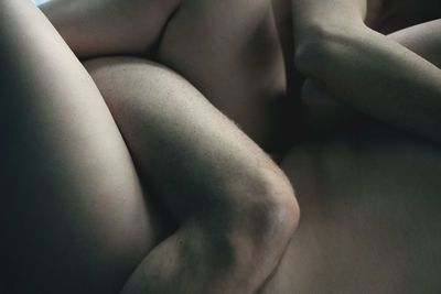 Midsection of naked couple