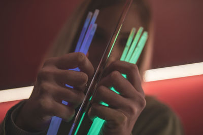 Woman holding colorful equipment