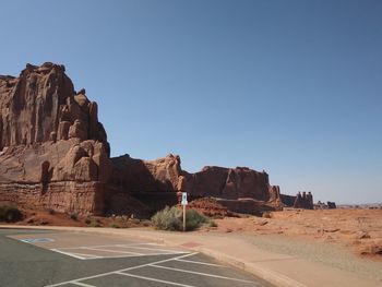 Scenic view of rock formation against clear blue sky