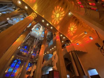 Low angle view of illuminated chandelier in building