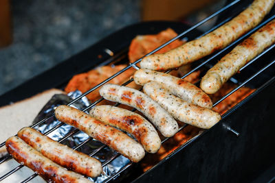 High angle view of meat on barbecue grill