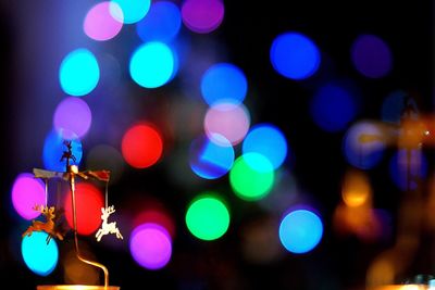 Close-up of christmas decoration against defocused lights