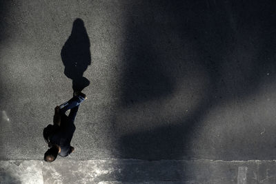 Upside down image of man skateboarding on street