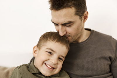 Portrait of father and son. dad loves his boy. positive family relationship. 