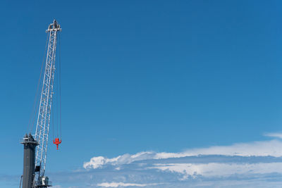 Construction crane against blue sky