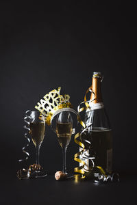 Champagne and happy new year headband with black background.