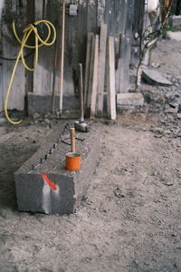 Close-up of work on floor against wall