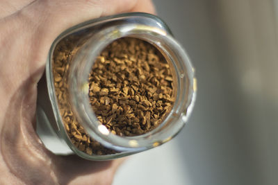 Freeze-dried coffee in a glass jar. coffee drink. granules made from coffee beans.